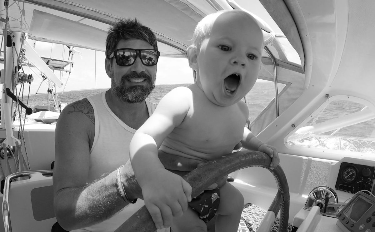Brian Trautman and his daughter steering the sailing boat